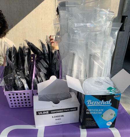 Array of KN95, N95, and surgical masks available for the public to take.